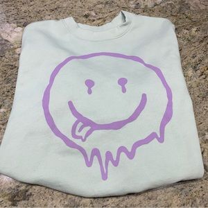 H&M divided smiley face sweatshirt. Size XL.